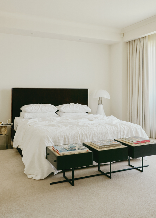 styled bedroom with white linen sheets