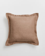 A square cushion cover in a warm taupe-brown 100% french flax linen fabric with a matching border, shown against a light grey background. - view