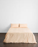 A close-up of Vanilla Organic Cotton by Bed Threads, showing soft, natural folds and gentle creases that create a subtle textured pattern—perfect for your GOTS certified percale bedding.