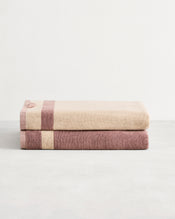 Stack of two cotton terry bath sheets in reversible colours lavender & creme. - view