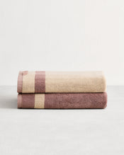 Stack of two cotton terry bath towels in reversible colours lavender & creme. - view